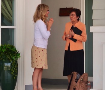  Kelly talking with Dr. Kae, a Thai leader about the Koala Love Project. 