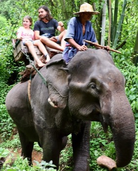  John & Janaya enjoying an elephant ride near Chiang Dao, Northern Thailand 