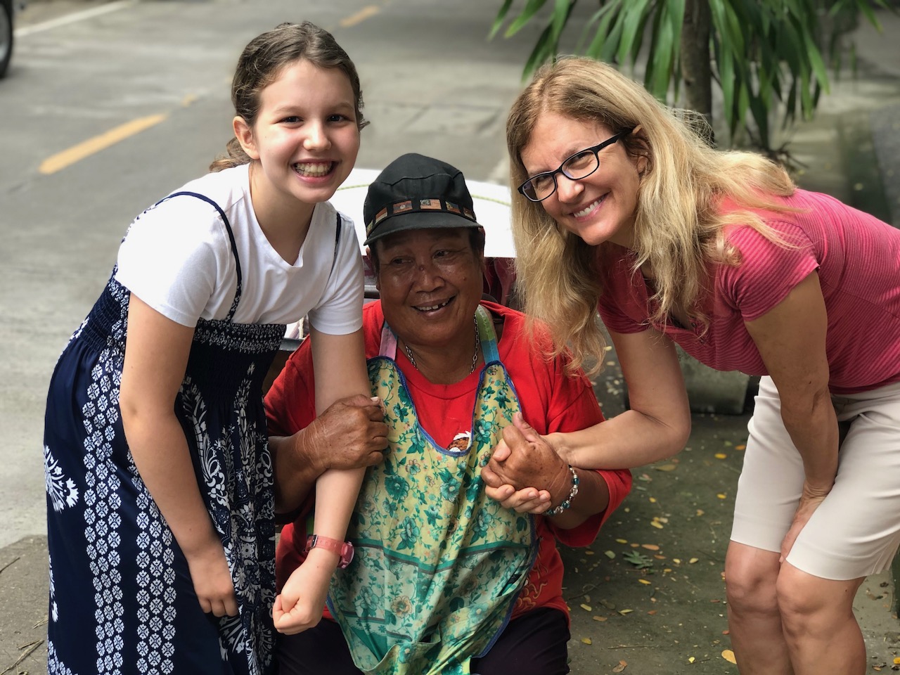  Kelly & Janaya ministering to a poor, street worker in Chiang Mai. She is a 'friend' we have known and ministered to for many years. 