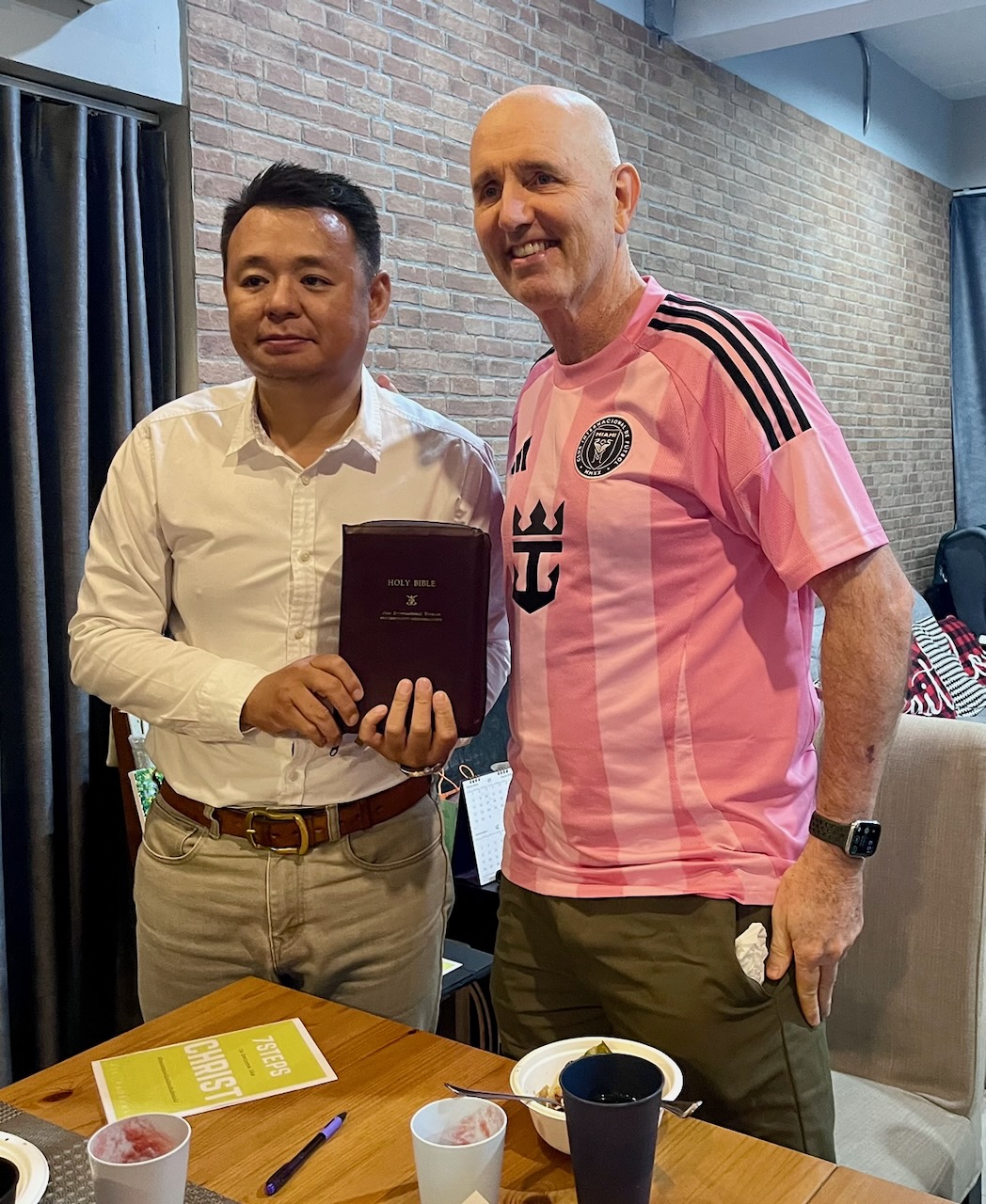 Joel presending Captain James with a Bible
