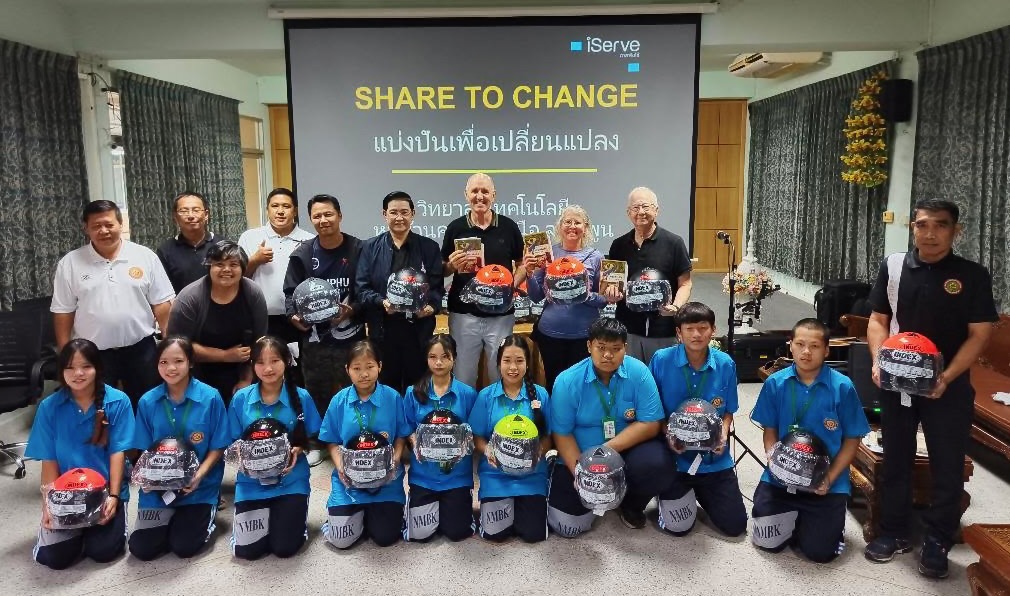 Presenting helmets & Bibles at a highshool in Lamphun