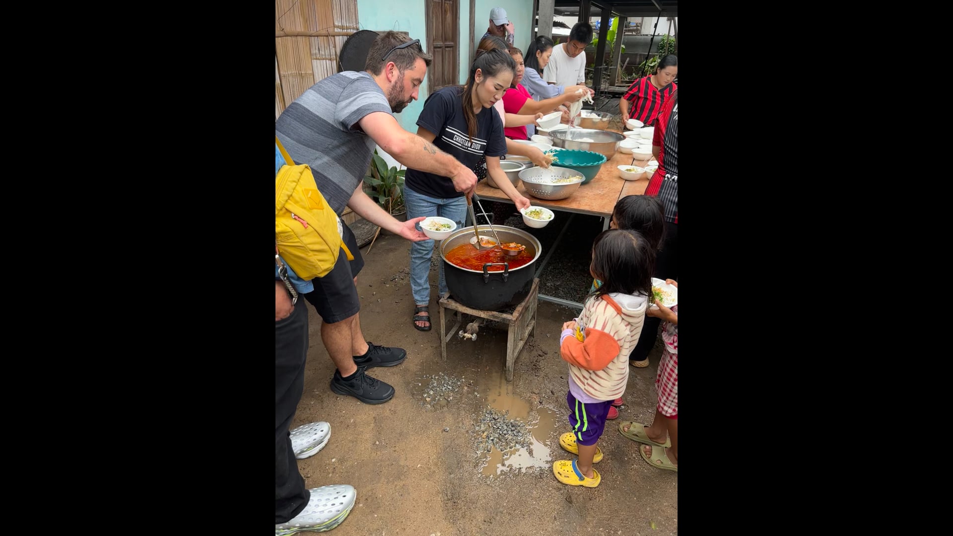 David Morrison serving food at HuayDeua Village May 10, 2026